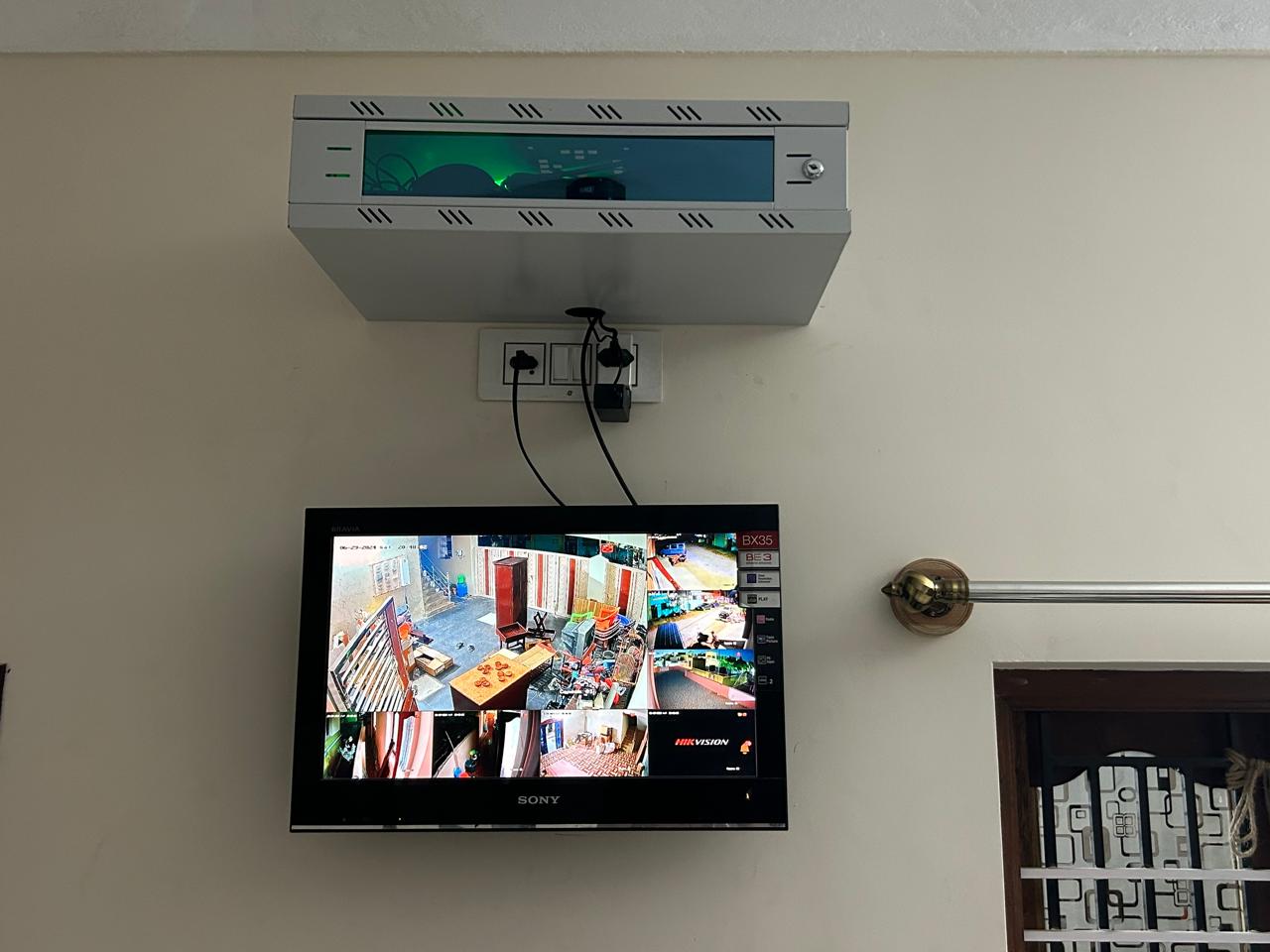 Technician configuring CCTV system at a Guduvancheri site